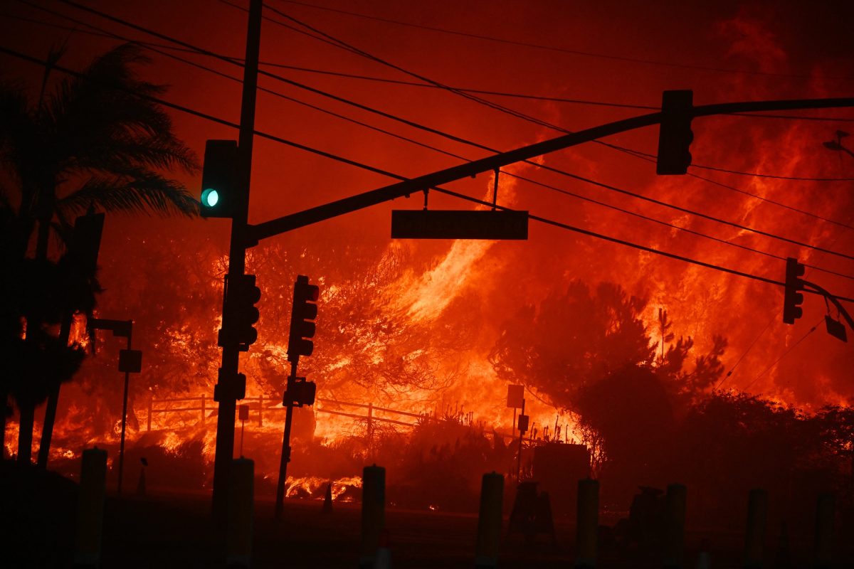 Flames overtake the intersection of Temescal Canyon and Pacific Coast Highway Fire at the Palisades Fire.