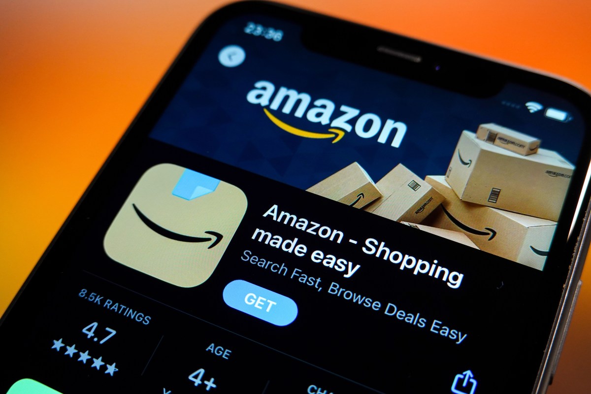 In this photo illustration, the Amazon logo is displayed in the Apple App Store on an iPhone.