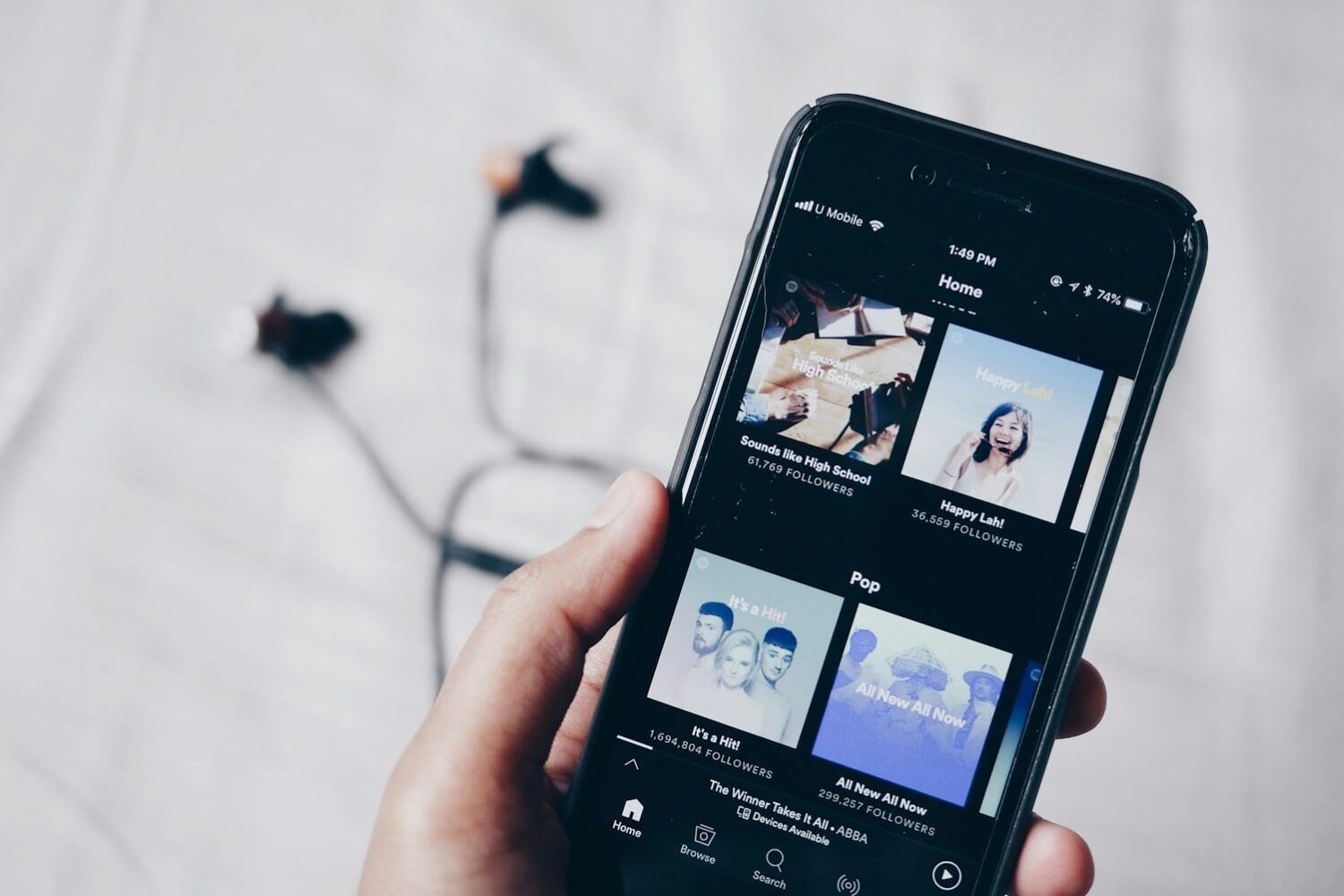 Spotify app next to a pair of wired headphones, Spotify may be looking to introduce HiFi audio.