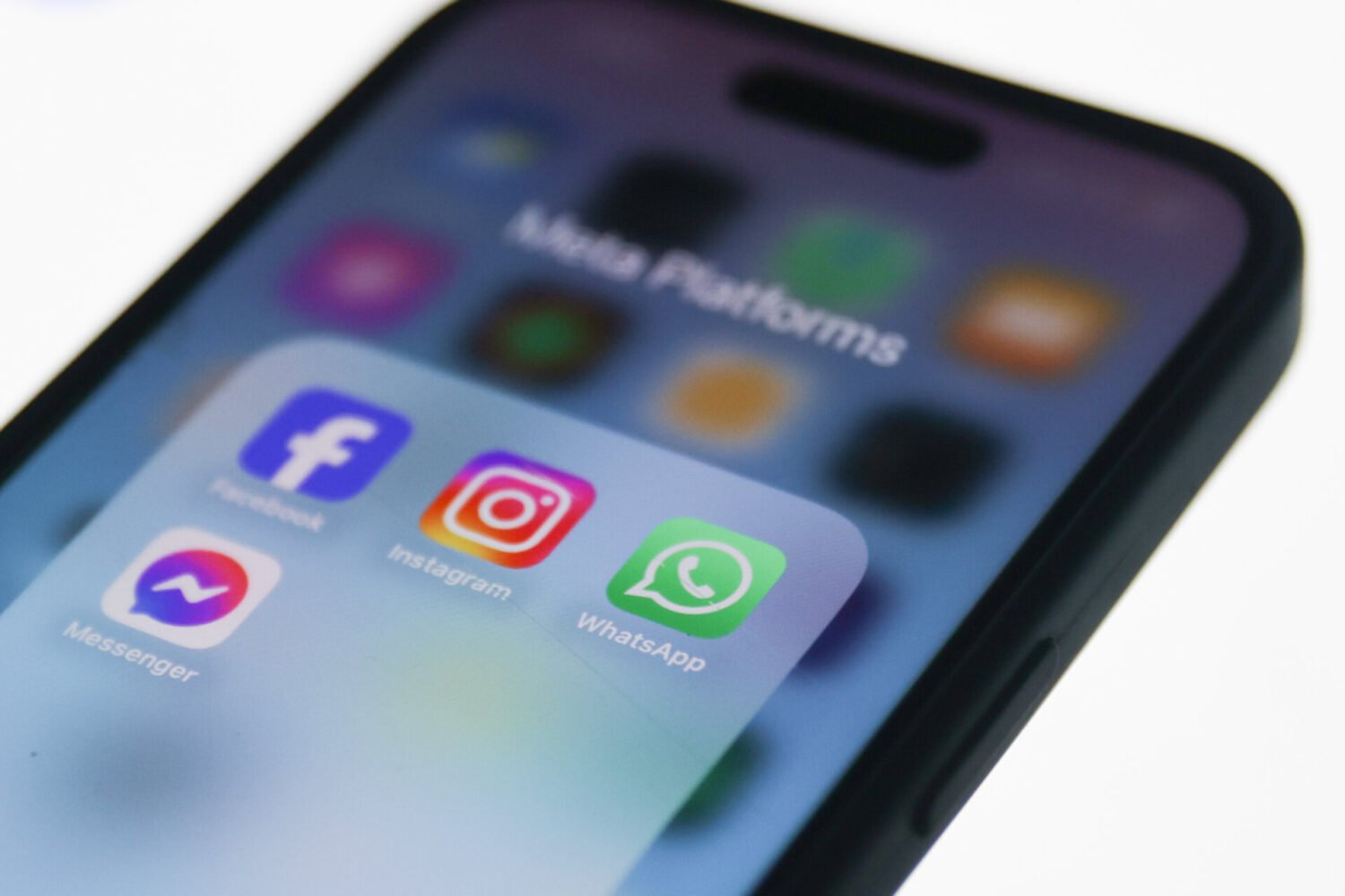 Facebook, Instagram, WhatsApp and Messenger icons displayed on a phone screen. Instagram may separate Reels from its main app.