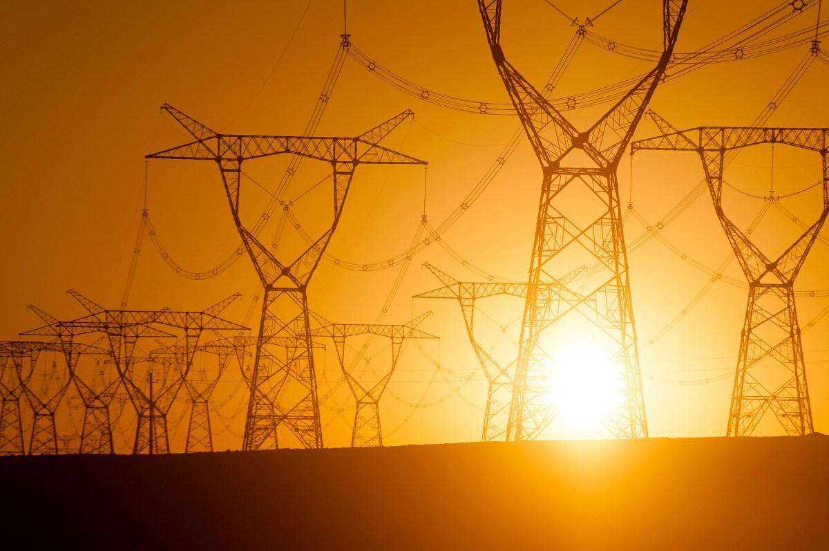 Silhouetted electricity pylon grid