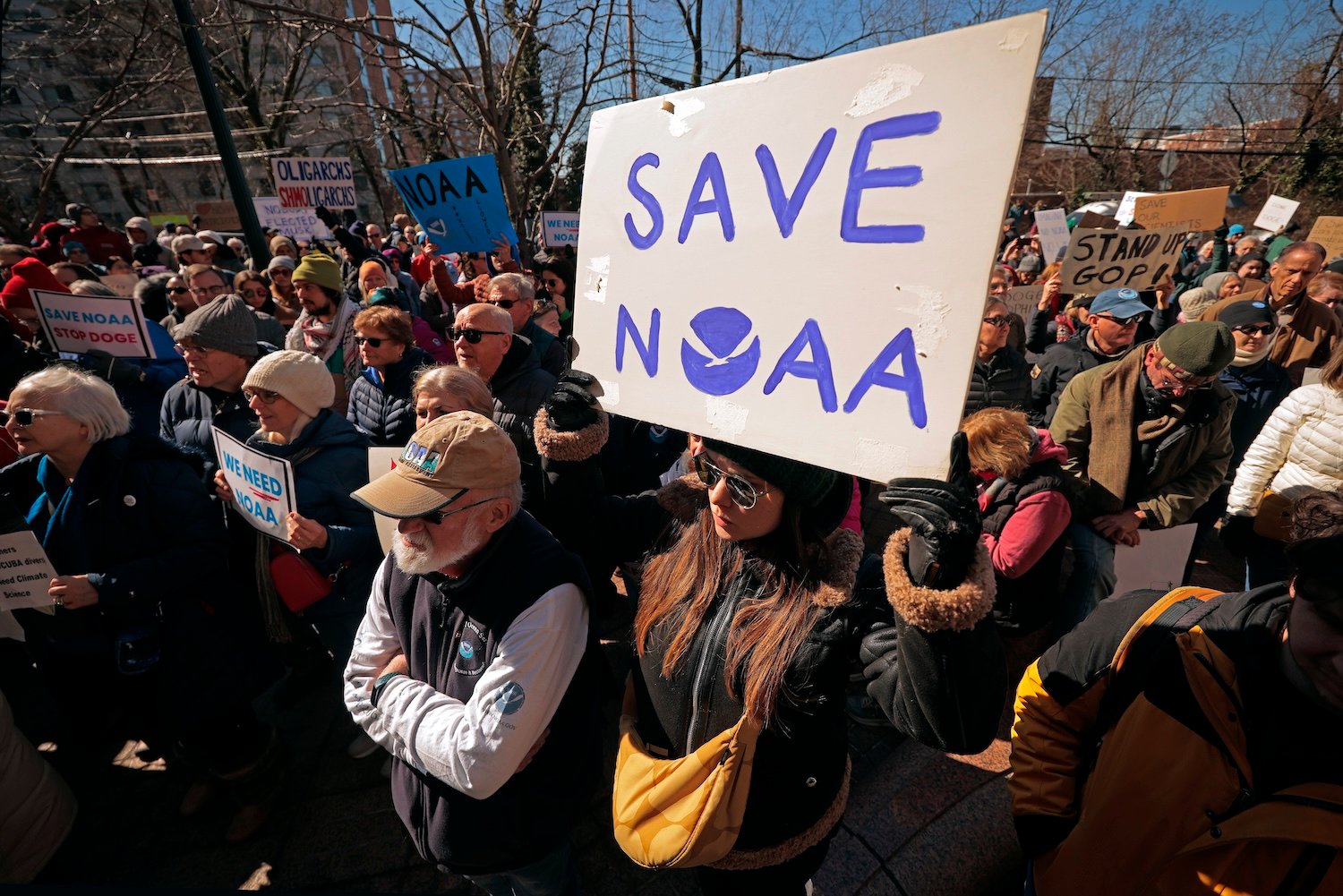 Hundreds of demonstrators gather to protest against Department of Government Efficiency (DOGE) cuts outside the headquarters of the National Oceanic and Atmospheric Administration on March 03, 2025 in Silver Spring, Maryland.