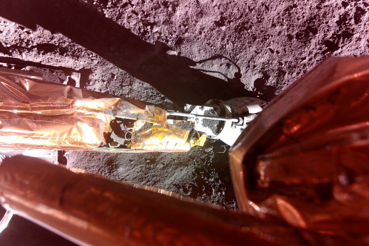 Honeybee Robotics' Lunar PlanetVac instrument shown at the end of Blue Ghost’s surface access arm.