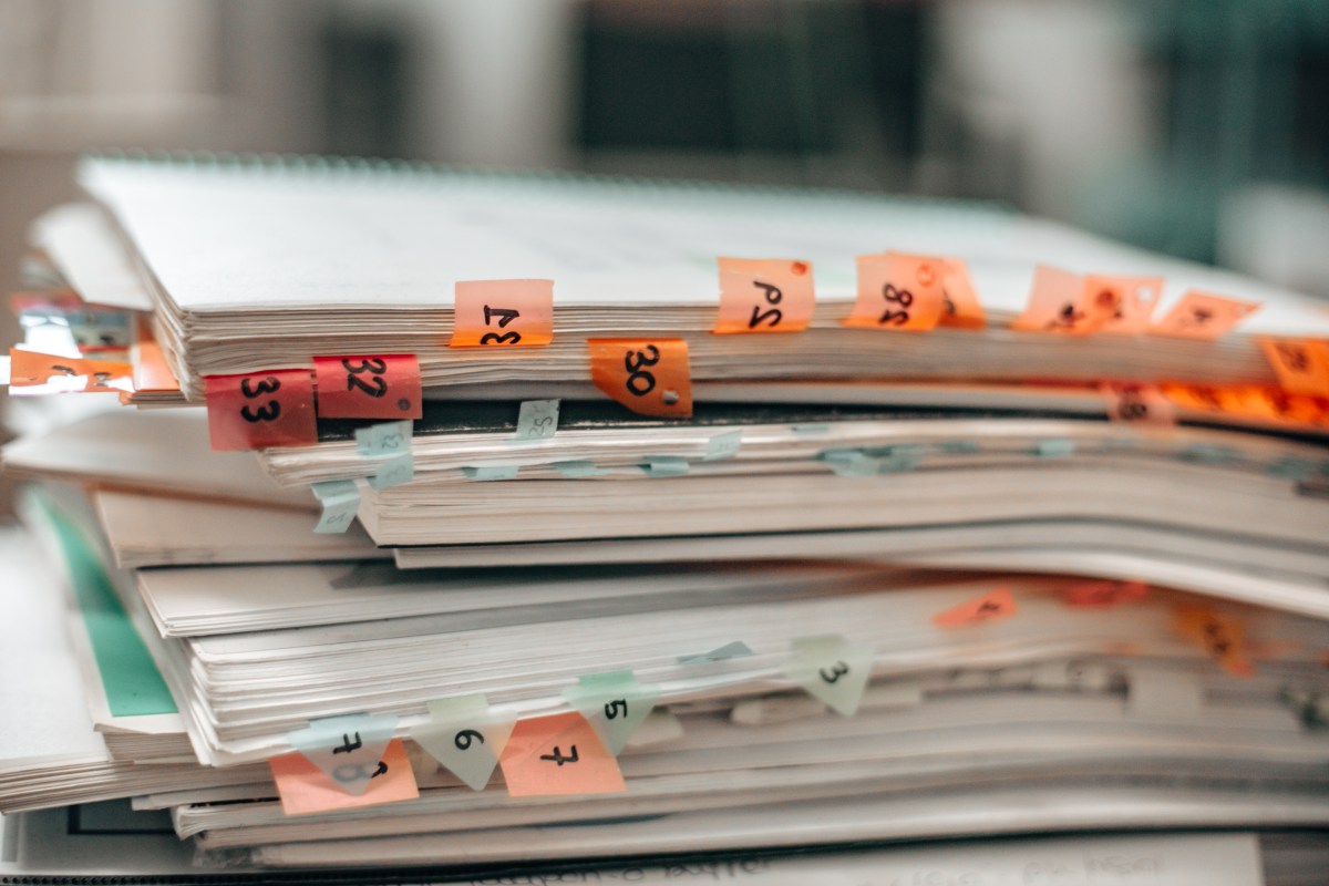 stack of notebooks, with tabbed pages