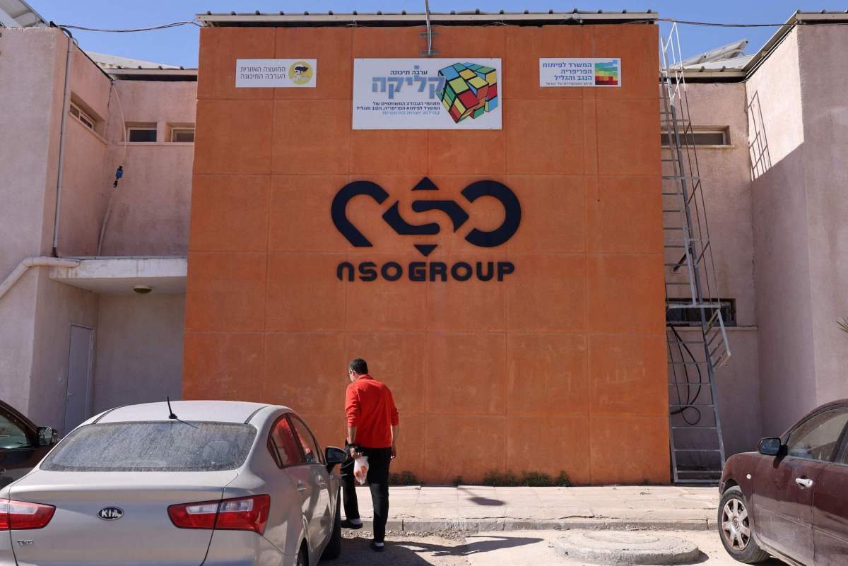 The NSO Group company logo is displayed on a wall of a building next to one of their branches in the southern Israeli Arava valley near Sapir community centre on February 8, 2022. - Israel's domestic spying scandal widened yesterday, with Prime Minister Naftali Bennett vowing government action following new reports that police illegally used the Pegasus malware to hack phones of dozens of prominent figures. (Photo by MENAHEM KAHANA / AFP) (Photo by MENAHEM KAHANA/AFP via Getty Images)