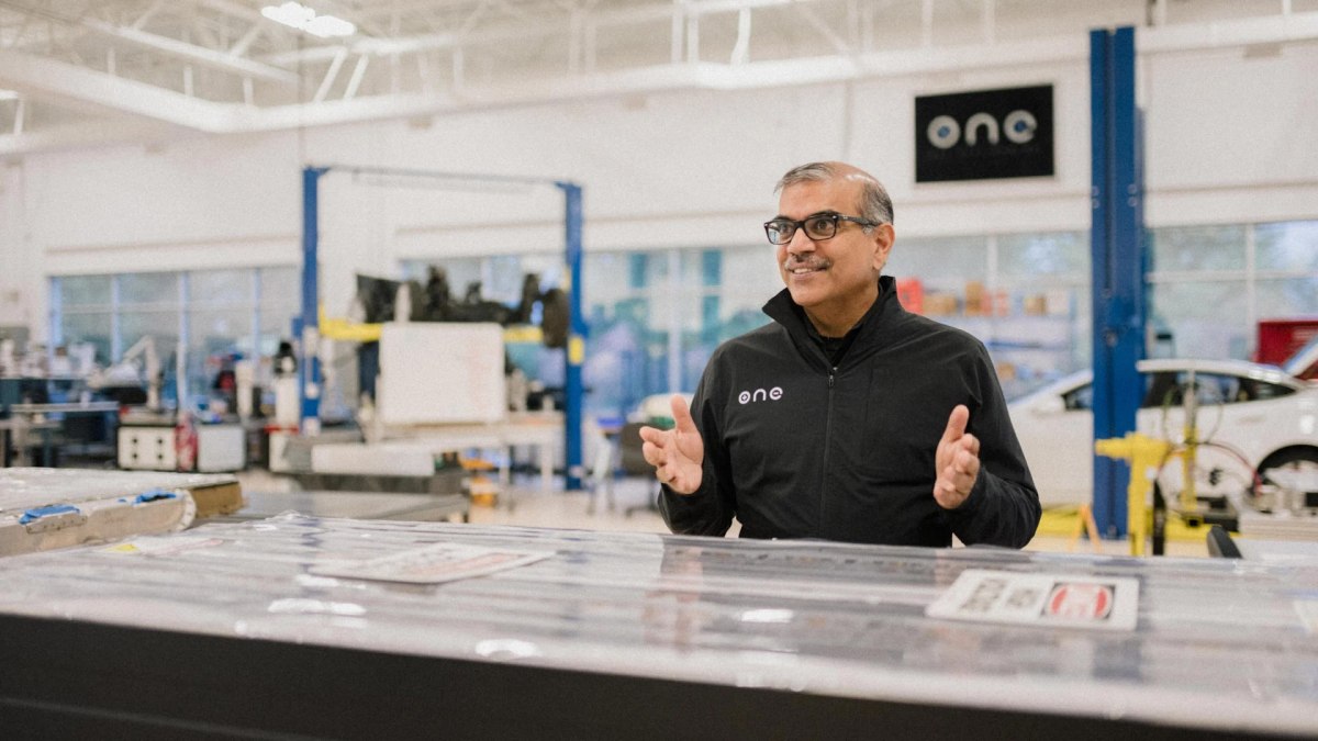 Mujeeb Ijaz talks in a battery lab.