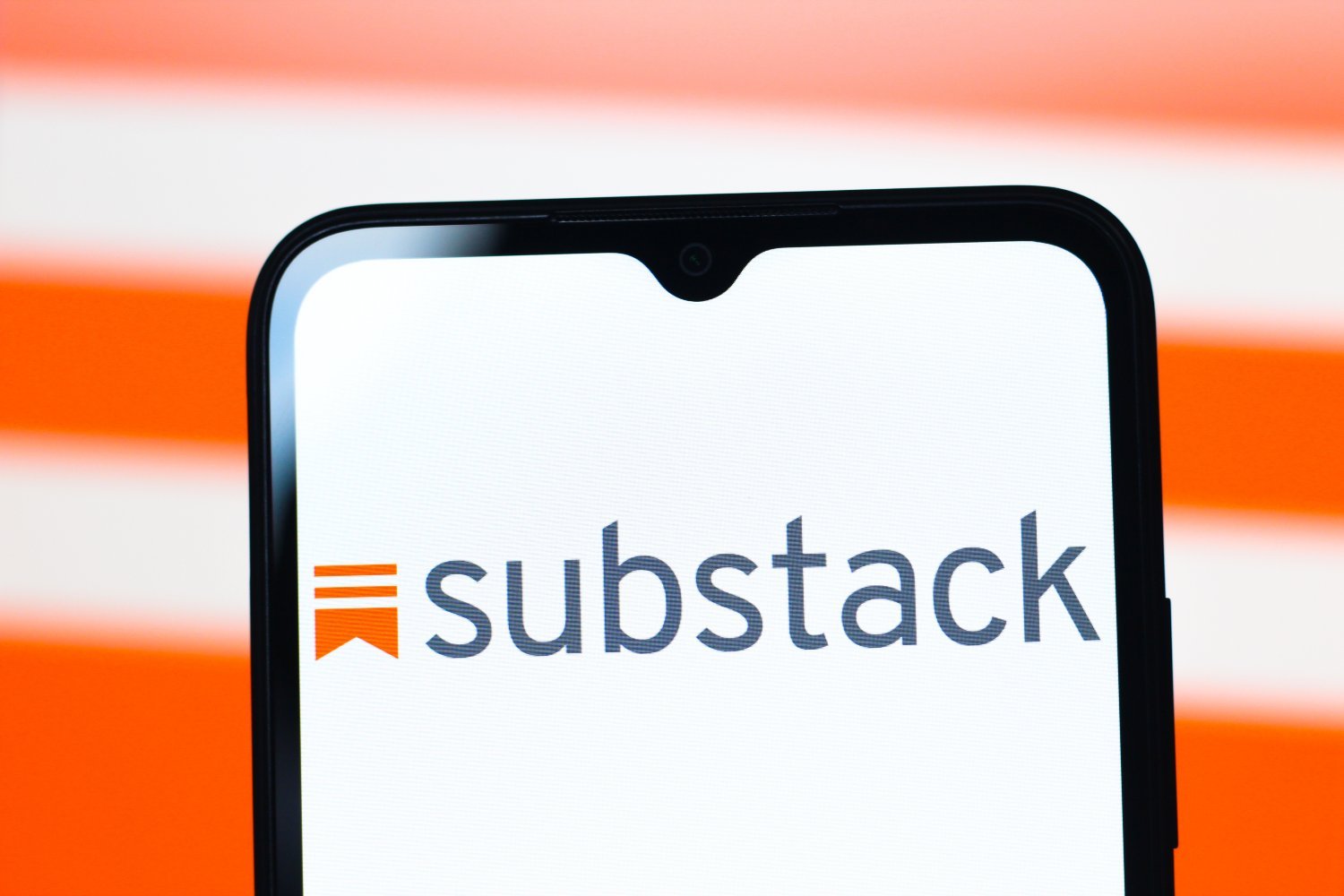 Subtack logo displayed on a smartphone