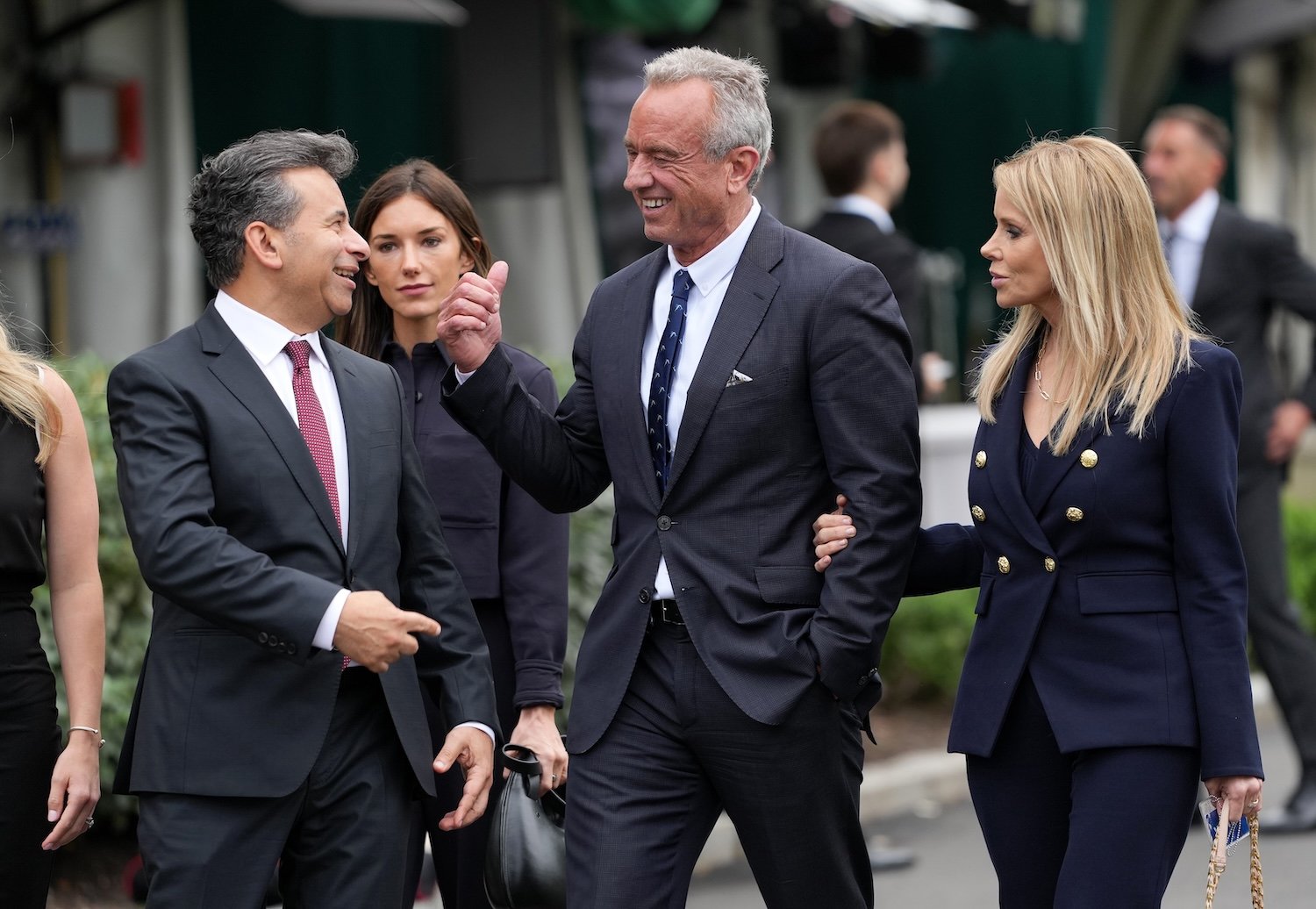 Health and Human Services Secretary Robert F. Kennedy Jr. (C) and his wife Cheryl Hines (R) walk with Food and Drug Administration (FDA) Commissioner Martin Makary and staff at the White House on May 22, 2025 in Washington, DC.